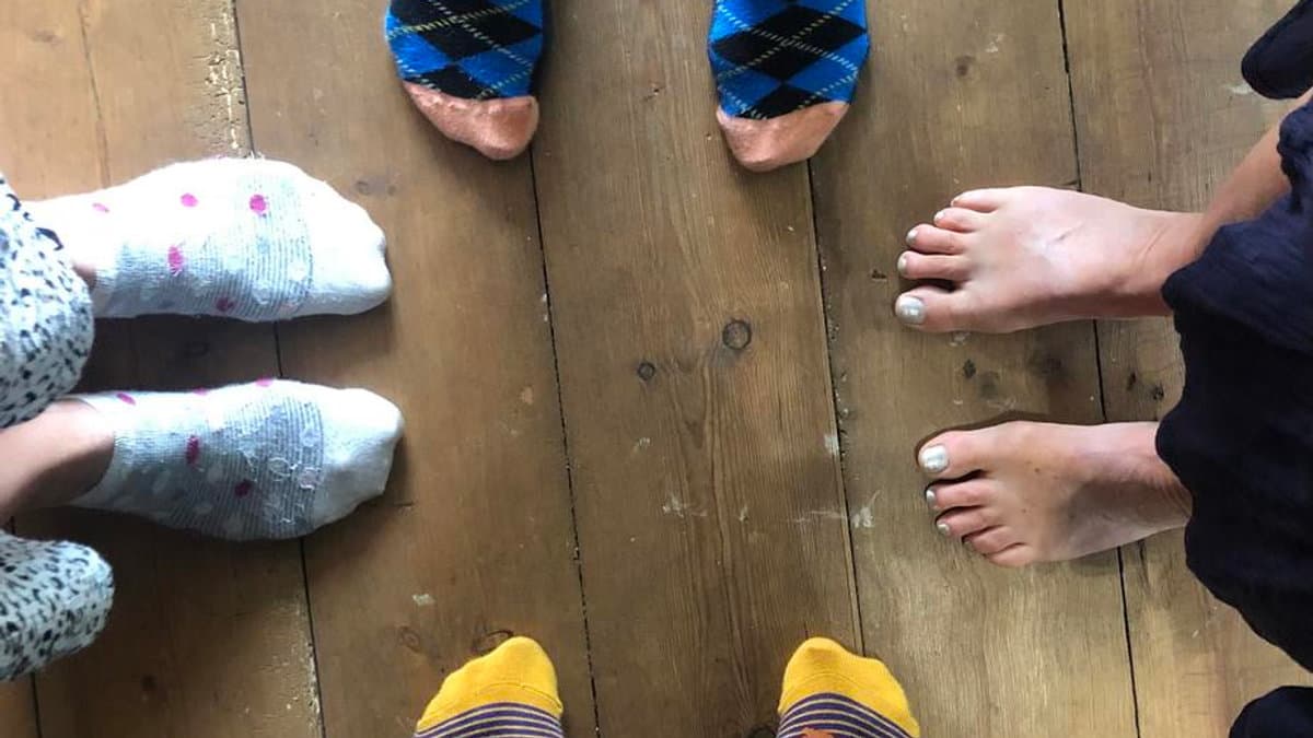 Bare feet on a wooden floor at Vibrant Life Centre